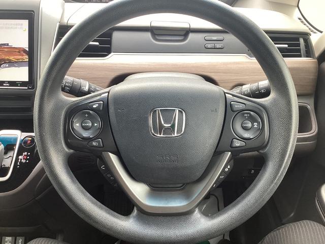 フリードハイブリッド ハイブリッド・Ｇホンダセンシング　９インチナビ　ＥＴＣ　ドラレコ前後　リア両側パワースライドドア　ＬＥＤヘッドライト＋アクティブコーナリングライト　センターテーブル　オートリトラミラー　ロールサンシェード運転席助手席シートヒーター（18枚目）