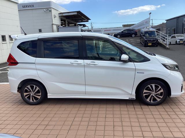 フリードハイブリッド ハイブリッド・EX 純正9インチナビTV・CSパッケージ・モデューロエアロ・ドライブレコーダー・ワンオーナー車 1オナ 地デジフルセグTV シ-トヒ-タ- 整備記録簿 リヤカメラ LEDライト フルオートエアコン ABS(3枚目)