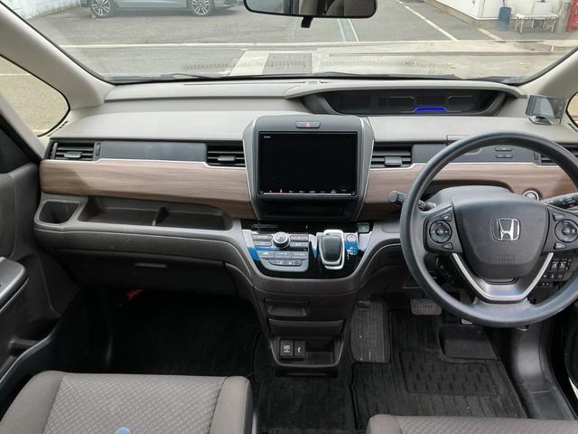 フリードハイブリッド ハイブリッド・Ｇホンダセンシング　９インチナビＴＶ・Ｃパッケージ・前後ドライブレコーダー・Ｂｌｕｅｔｏｏｔｈ・バックカメラ・ワンオーナー車　軽減ブレーキ　キーフリーシステム　Ｂｌｕｅｔｏｏｔｈ音楽　ミュージックプレイヤー接続可　記録簿（4枚目）