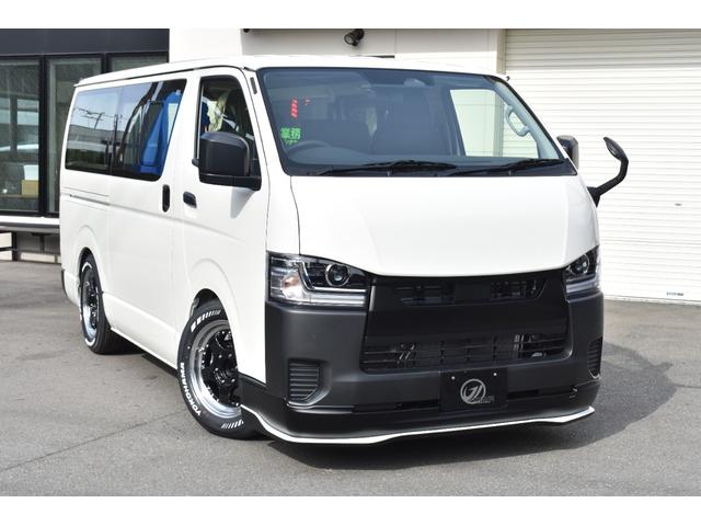 ハイエースバン ロングＤＸ　未登録新車／９型ＤＸ白黒パッケージ／４１５ＣＯＢＲＡＦリップ・ボンネット・Ｒスポイラー／３．０インチローダウン／ＳＳＲ１７インチＡＷ／ホワイトレターバンタイヤ／グリル・エンブレム塗装／ＬＥＤヘッド／（3枚目）