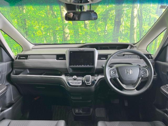 フリードハイブリッド ハイブリッド・Ｇホンダセンシング　両側電動ドア　ＳＤナビ　バックカメラ　衝突被害軽減システム　レーダークルーズ　禁煙車　ハーフレザーシート　ドラレコ　コーナーセンサー　スマートキー　ＬＥＤヘッド　ビルトインＥＴＣ（2枚目）