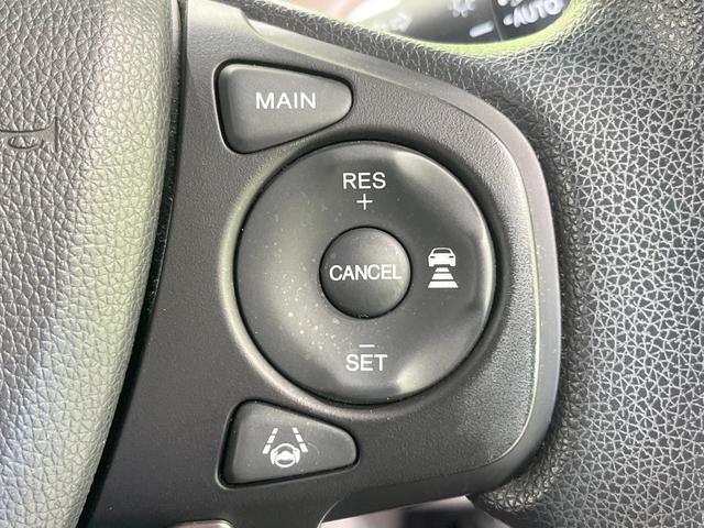 フリードハイブリッド ハイブリッド・Ｇホンダセンシング　両側電動ドア　純正ＳＤナビ　バックカメラ　衝突被害軽減システム　禁煙車　スマートキー　ＬＥＤヘッド　ビルトインＥＴＣ　車線逸脱警報　オートライト　オートエアコン　Ｂｌｕｅｔｏｏｔｈ　ＣＤ　ＤＶＤ再生（7枚目）