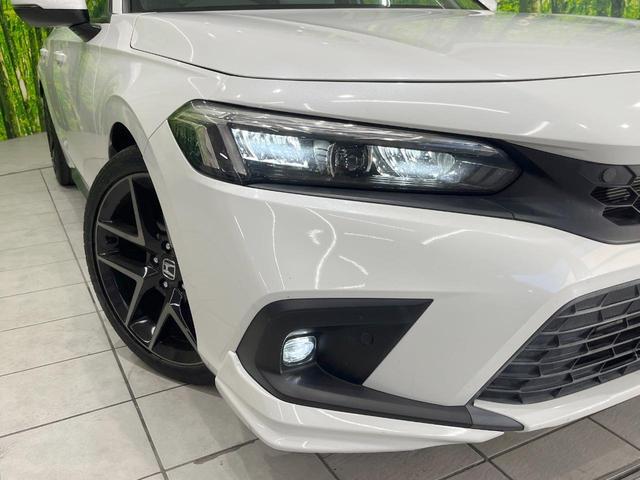 シビック ＥＸ　純正ナビ　衝突被害軽減システム　レーダークルーズ　バックカメラ　ドラレコ　スマートキー　ＬＥＤヘッド　ＥＴＣ２．０　ハーフレザーシート　純正１８インチアルミ　車線逸脱警報　オートライト　オートエアコン（12枚目）