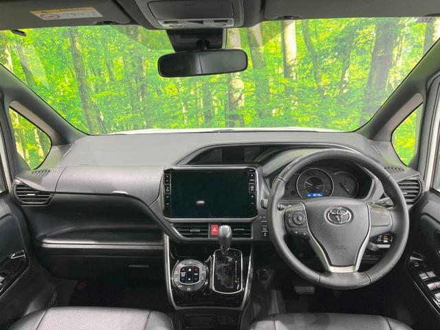 ヴォクシー ＺＳ　煌ＩＩ　両側電動ドア　ＳＤナビ　後席モニター　バックカメラ　衝突被害軽減システム　禁煙車　コーナーセンサー　スマートキー　ＬＥＤヘッド　ビルトインＥＴＣ　クルコン　純正１６インチアルミ　車線逸脱警報（2枚目）