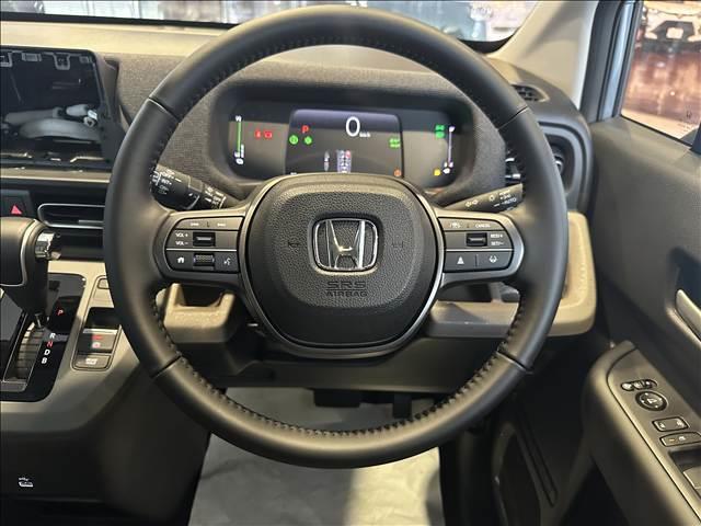 フリード e:HEVエアー EX 登録済未使用車 バックカメラ ブレーキサポート レーンサポート ソナー クルーズコントロール シートヒーター 両側電動スライドドア スマートキー アイドリングストップ オートエアコン 電動格納ミラー(11枚目)