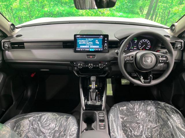 ヴェゼル ｅ：ＨＥＶ　Ｚ　登録済未使用車　純正９インチナビ　全周囲カメラ　フルセグ　パワーバックドア　ＥＴＣ　ブラインドスポットモニター　衝突軽減　レーダークルーズ　前席シートヒーター　ステアリングヒーター　ＬＥＤヘッド（2枚目）