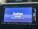 フィットハイブリッド Lパッケージ 禁煙車 純正ナビ バックカメラ クルコン ETC スマートキー オートハイビーム オートライト オートエアコン LEDヘッドライト Bluetooth接続 CD/DVD再生 地デジ 盗難防止システム 中古車画像_3