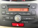 ムーヴ Xリミテッド 禁煙車 スマートキー 純正14インチアルミホイール オートエアコン CD 電動格納ミラー アイドリングストップ プライバシーガラス シートリフター 盗難防止システム 中古車画像_3