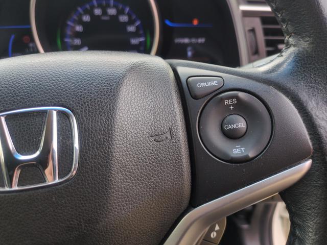 フィットハイブリッド Ｌパッケージ　ハイブリッド　ＥＴＣ　ＴＶ　オートクルーズコントロール　ＬＥＤヘッドランプ　スマートキー　電動格納ミラー　ＡＴ　盗難防止システム　衝突安全ボディ　ＡＢＳ　ＥＳＣ　エアコン　パワーステアリング（11枚目）