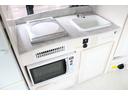 ハイエースバン ＲＶビックフット　リトルノオクタービアＭ　ＦＦヒーター　１５００Ｗインバーター　冷蔵庫　ソーラーパネル（２枚）　シンク　ＩＨコンロ　レンジ　ツインサブＢＴ　走行充電　外部充電　マックスファン　フリップダウンモニター　リアスピーカー　１オーナー（7枚目）