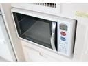 ＲＶビックフット　リトルノオクタービアＭ　ＦＦヒーター　１５００Ｗインバーター　冷蔵庫　ソーラーパネル（２枚）　シンク　ＩＨコンロ　レンジ　ツインサブＢＴ　走行充電　外部充電　マックスファン　フリップダウンモニター　リアスピーカー　１オーナー（54枚目）