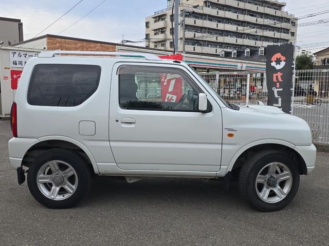 ジムニー ワイルドウインド 4WD キーレスエントリー 電動格納ミラー シートヒーター AT ABS CD ルーフレール アルミホイール 衝突安全ボディ エアコン パワーステアリング パワーウィンドウ 運転席エアバッグ(14枚目)