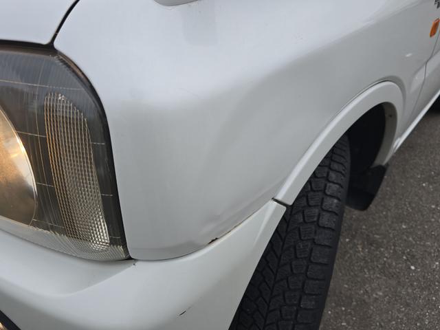 ジムニー ワイルドウインド 4WD キーレスエントリー 電動格納ミラー シートヒーター AT ABS CD ルーフレール アルミホイール 衝突安全ボディ エアコン パワーステアリング パワーウィンドウ 運転席エアバッグ(46枚目)