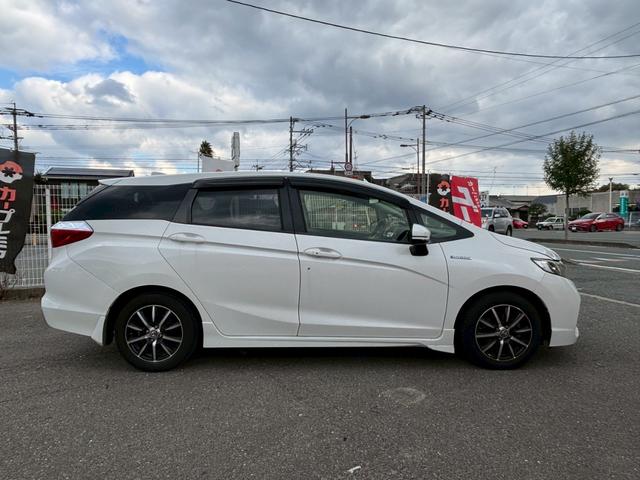 シャトル ハイブリッド　アルミホイール　スマートキー　ＡＴ　盗難防止システム　衝突安全ボディ　ＡＢＳ　ＥＳＣ　ＣＤ　ミュージックプレイヤー接続可　エアコン　パワーステアリング　パワーウィンドウ（14枚目）