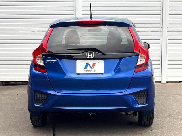 フィット 13G・Lパッケージ 禁煙車 スマートキー ビルトインETC オートライト オートエアコン Bluetooth CD DVD再生 地デジ バックカメラ 横滑り防止装置 電動格納ミラー ドアバイザー パワーウインドウ(15枚目)