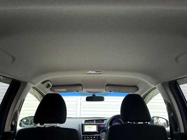 フィット 13G・Lパッケージ 禁煙車 スマートキー ビルトインETC オートライト オートエアコン Bluetooth CD DVD再生 地デジ バックカメラ 横滑り防止装置 電動格納ミラー ドアバイザー パワーウインドウ(33枚目)