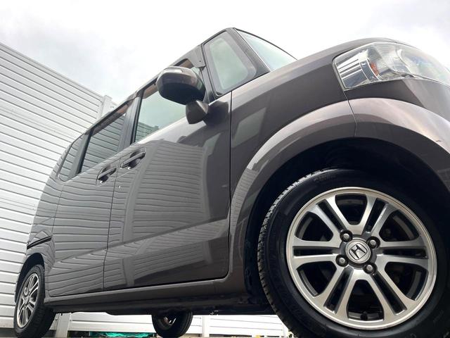 Ｎ－ＢＯＸ Ｇ・Ｌパッケージ　電動スライドドア　ＳＤナビ　バックカメラ　禁煙車　スマートキー　純正１４インチアルミ　オートエアコン　ＣＤ　地デジ　横滑り防止装置　電動格納ミラー　ドアバイザー　パワーステアリング　パワーウィンドウ（12枚目）