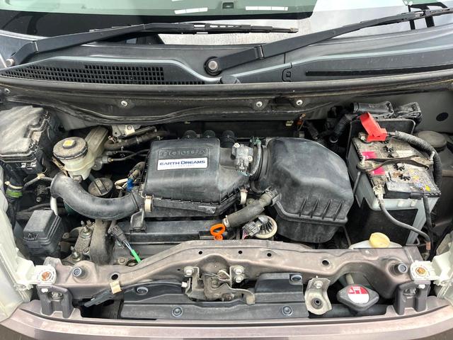 Ｎ－ＢＯＸ Ｇ・Ｌパッケージ　電動スライドドア　ＳＤナビ　バックカメラ　禁煙車　スマートキー　純正１４インチアルミ　オートエアコン　ＣＤ　地デジ　横滑り防止装置　電動格納ミラー　ドアバイザー　パワーステアリング　パワーウィンドウ（17枚目）