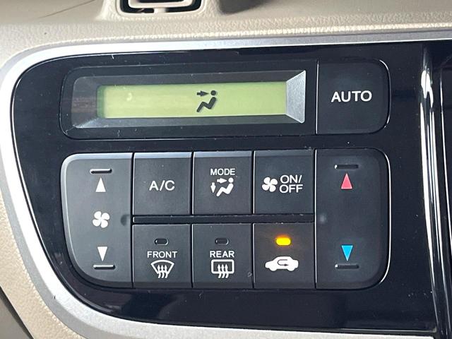 Ｎ－ＢＯＸ Ｇ・Ｌパッケージ　電動スライドドア　ＳＤナビ　バックカメラ　禁煙車　スマートキー　純正１４インチアルミ　オートエアコン　ＣＤ　地デジ　横滑り防止装置　電動格納ミラー　ドアバイザー　パワーステアリング　パワーウィンドウ（22枚目）