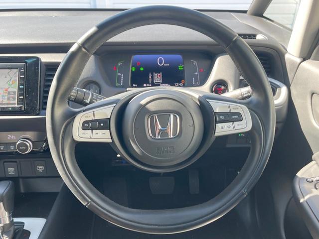 フィット ｅ：ＨＥＶホーム　純正ＳＤナビ　バックカメラ　衝突被害軽減システム　レーダークルーズ　ドラレコ　コーナーセンサー　スマートキー　ＬＥＤヘッド　ＥＴＣ　車線逸脱警報　オートライト　オートエアコン　Ｂｌｕｅｔｏｏｔｈ（14枚目）