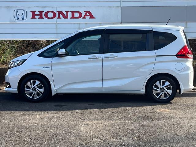 フリードハイブリッド ハイブリッド・Ｇホンダセンシング　ＬＥＤヘッドライト　弊社下取り車　ディーラーメン車両　ＥＴＣ　前後ドラレコ　純正ナビ　ＣＤ／ＤＶＤ再生可　ＴＶ　オートエアコン　Ｂｌｕｅｔｏｏｔｈ　追突軽減ブレーキ　車線逸脱抑制機能　リアカメラ（12枚目）