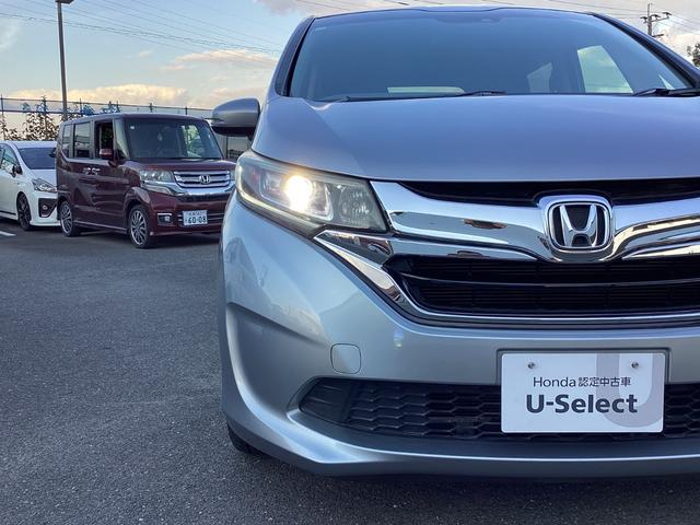 フリードハイブリッド ハイブリッド・Ｇホンダセンシング　ワンオーナー・７人乗り・ナビ・リアカメラ・ＬＥＤヘッドライト・衝突軽減ブレーキ・クルーズコントロール・スマートキー・ＥＴＣ・オートエアコン・　キーフリーシステム　１オ－ナ－　記録簿　ＤＶＤ再生可能（27枚目）