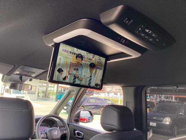 ステップワゴン e:HEVスパーダプレミアムライン ワンオーナー・11インチナビ・15インチルーフモニター・前後ドラレコ・マルチビューカメラ・パワーテールゲート・オットマンシート・BSI・オートエアコン・シートヒーター・ETC・取説・記録簿 Fセグ(11枚目)