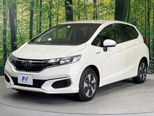 フィットハイブリッド F 禁煙車 純正8型SDナビ バックカメラ 衝突被害軽減システム レーダークルーズ ドラレコ スマートキー ビルトインETC 車線逸脱警報 オートエアコン Bluetooth CD DVD フルセグTV(63枚目)