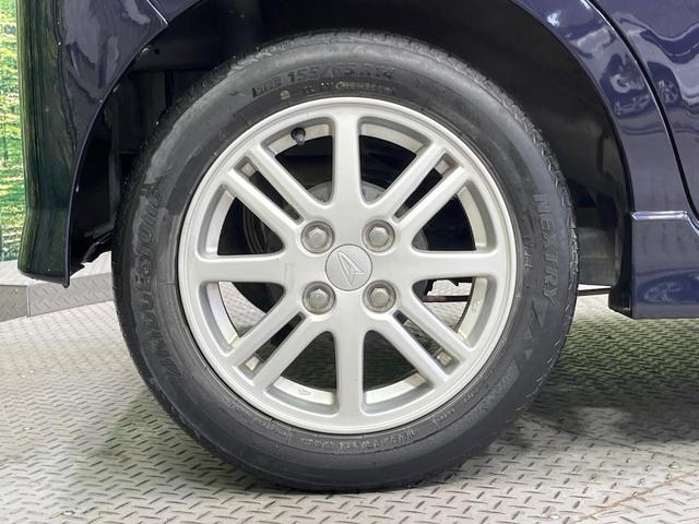 タント カスタムＸリミテッド　禁煙車　電動スライドドア　ポータブルナビ　スマートキー　ＨＩＤヘッドライト　ＥＴＣ　純正１５インチアルミホイール　オートエアコン　ＨＩＤフォグライト　革巻きステアリングホイール（28枚目）