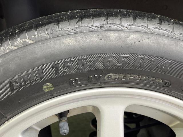 タント カスタムＸリミテッド　禁煙車　電動スライドドア　ポータブルナビ　スマートキー　ＨＩＤヘッドライト　ＥＴＣ　純正１５インチアルミホイール　オートエアコン　ＨＩＤフォグライト　革巻きステアリングホイール（29枚目）