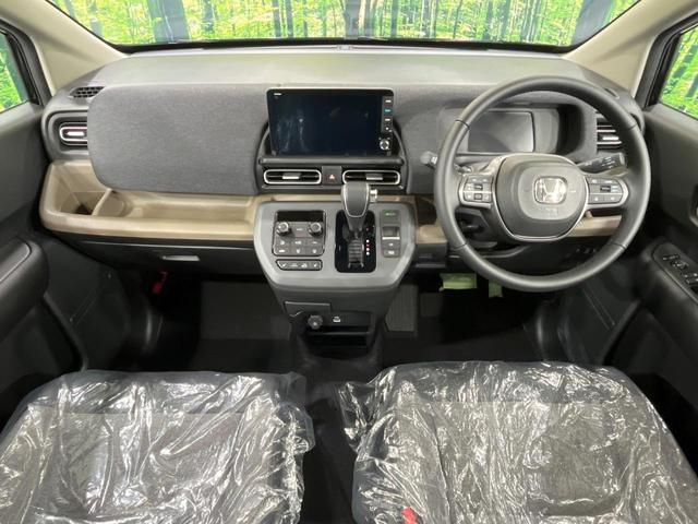 フリード ｅ：ＨＥＶエアー　ＥＸ　登録済未使用車　純正９型ナビ　両側電動ドア　バックカメラ　衝突被害軽減システム　レーダークルーズ　コーナーセンサー　シートヒーター　ＬＥＤヘッドライト　純正１５インチアルミ　Ａｐｐｌｅｃａｒｐｌａｙ（2枚目）