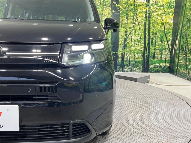 フリード ｅ：ＨＥＶエアー　ＥＸ　登録済未使用車　純正９型ナビ　両側電動ドア　バックカメラ　衝突被害軽減システム　レーダークルーズ　コーナーセンサー　シートヒーター　ＬＥＤヘッドライト　純正１５インチアルミ　Ａｐｐｌｅｃａｒｐｌａｙ（13枚目）