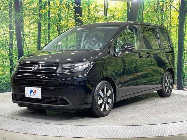 フリード ｅ：ＨＥＶエアー　ＥＸ　登録済未使用車　純正９型ナビ　両側電動ドア　バックカメラ　衝突被害軽減システム　レーダークルーズ　コーナーセンサー　シートヒーター　ＬＥＤヘッドライト　純正１５インチアルミ　Ａｐｐｌｅｃａｒｐｌａｙ（57枚目）