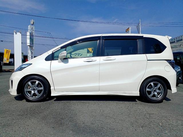 フリードハイブリッド ジャストセレクション　ナビ　フルセグ　ＤＶＤ　ＢＴ　Ｂカメラ　電動スライドドア　フリップダウン　スマートキー　クルコン　ステリモ　電格ミラー　Ｐガラス　シートリフター　横滑り防止機能　チルトステアリング　ウィンカーミラー（5枚目）