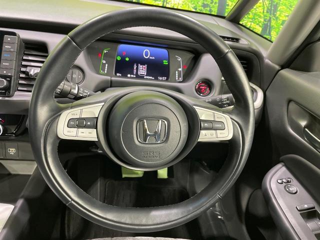 フィット ｅ：ＨＥＶホーム　禁煙車　純正９型ナビ　ホンダセンシング　アダプティブクルーズコントロール　ＬＥＤヘッドライト　バックカメラ　オートエアコン　ＥＴＣ　ドライブレコーダー　Ｂｌｕｅｔｏｏｔｈ　パーキングセンサーシステム（11枚目）