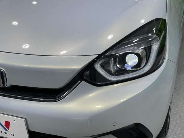 フィット ｅ：ＨＥＶホーム　禁煙車　純正９型ナビ　ホンダセンシング　アダプティブクルーズコントロール　ＬＥＤヘッドライト　バックカメラ　オートエアコン　ＥＴＣ　ドライブレコーダー　Ｂｌｕｅｔｏｏｔｈ　パーキングセンサーシステム（12枚目）
