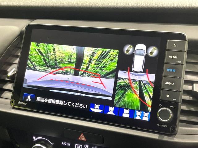フィット ｅ：ＨＥＶホーム　禁煙車　純正９インチナビ　ホンダセンシング　アダプティブクルーズ　ＥＴＣ　Ｂｌｕｅｔｏｏｔｈ接続　ドラレコ　スマートキー　ハーフレザーシート　ＬＥＤヘッド　コーナーセンサー　オートライト（5枚目）
