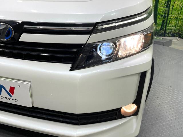 ヴォクシー ハイブリッドＶ　禁煙車　ナビ　両側電動ドア　後席モニター　バックカメラ　ドラレコ　スマートキー　ＬＥＤヘッド　ＥＴＣ　純正１６インチアルミ　オートエアコン　リアエアコン　Ｂｌｕｅｔｏｏｔｈ　ＣＤ　ＤＶＤ再生　地デジ（13枚目）