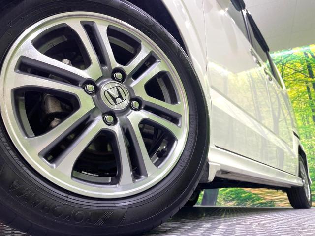 Ｎ－ＢＯＸカスタム Ｇ・Ｌパッケージ　禁煙車　ＳＤナビ　パワースライドドア　ＨＩＤヘッド　オートライト／エアコン　スマートキー　アイドリングストップ　純正１４インチアルミ　電動格納ミラー　横滑り防止装置　盗難防止システム（14枚目）