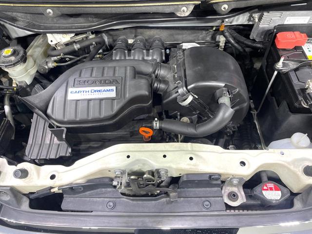 Ｎ－ＢＯＸカスタム Ｇ・Ｌパッケージ　禁煙車　ＳＤナビ　パワースライドドア　ＨＩＤヘッド　オートライト／エアコン　スマートキー　アイドリングストップ　純正１４インチアルミ　電動格納ミラー　横滑り防止装置　盗難防止システム（18枚目）