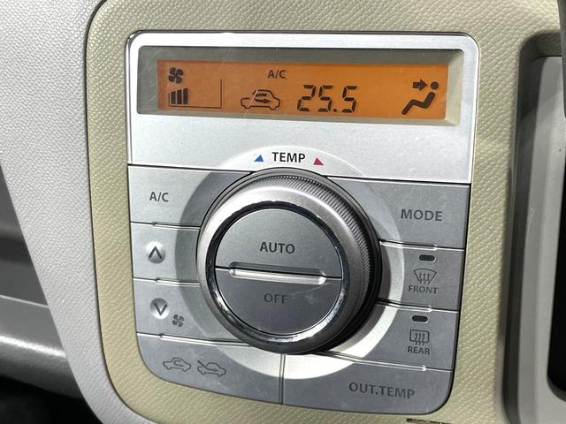 ワゴンＲ ＦＸリミテッドＩＩ　ＳＤナビ　禁煙車　スマートキー　ＥＴＣ　純正１４インチアルミ　盗難防止装置　革巻きステアリング　オートエアコン　地デジ　電動格納ミラー　プライバシーガラス（6枚目）