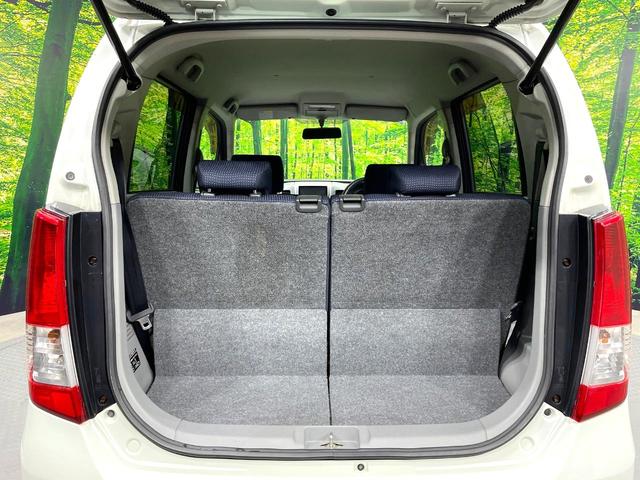 ワゴンＲ ＦＸリミテッドＩＩ　ＳＤナビ　禁煙車　スマートキー　ＥＴＣ　純正１４インチアルミ　盗難防止装置　革巻きステアリング　オートエアコン　地デジ　電動格納ミラー　プライバシーガラス（10枚目）