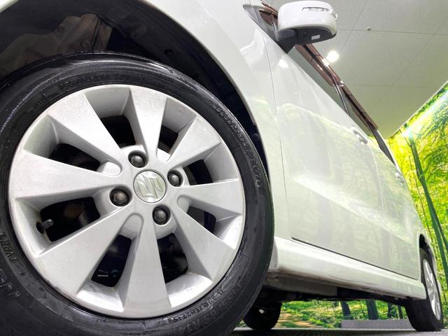 ワゴンＲ ＦＸリミテッドＩＩ　ＳＤナビ　禁煙車　スマートキー　ＥＴＣ　純正１４インチアルミ　盗難防止装置　革巻きステアリング　オートエアコン　地デジ　電動格納ミラー　プライバシーガラス（13枚目）