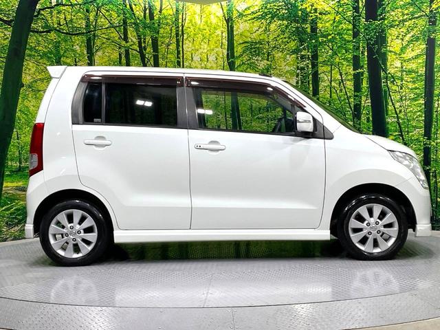 ワゴンＲ ＦＸリミテッドＩＩ　ＳＤナビ　禁煙車　スマートキー　ＥＴＣ　純正１４インチアルミ　盗難防止装置　革巻きステアリング　オートエアコン　地デジ　電動格納ミラー　プライバシーガラス（24枚目）