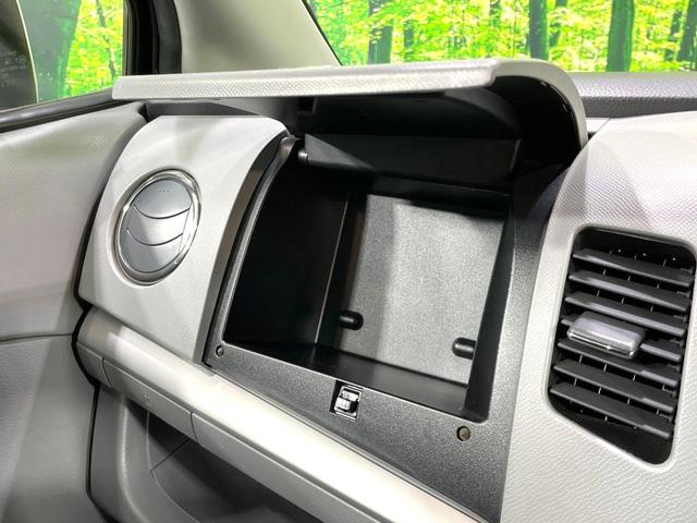 ワゴンＲ ＦＸリミテッドＩＩ　ＳＤナビ　禁煙車　スマートキー　ＥＴＣ　純正１４インチアルミ　盗難防止装置　革巻きステアリング　オートエアコン　地デジ　電動格納ミラー　プライバシーガラス（32枚目）