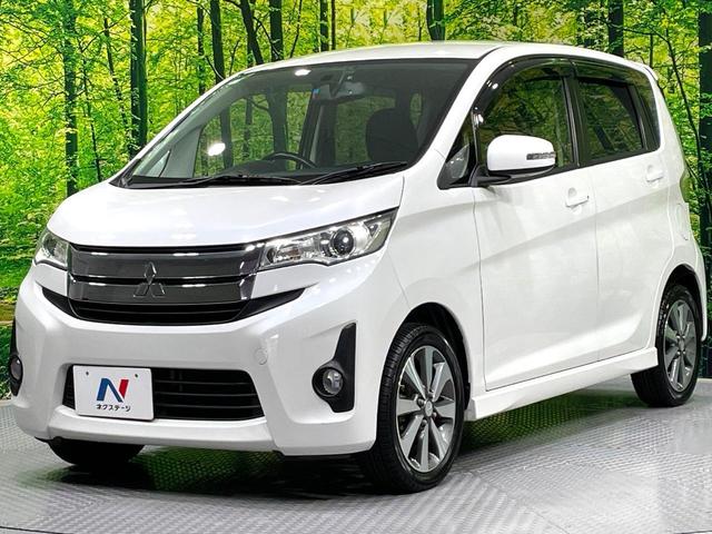 ｅＫカスタム Ｔ　ターボ　ｃｌａｒｉｏｎナビ　バックカメラ　禁煙車　ＥＴＣ　スマートキー　ＨＩＤヘッドライト　オートライト　オートエアコン　純正１４インチＡＷ　ＣＤ／ＤＶＤ再生（16枚目）