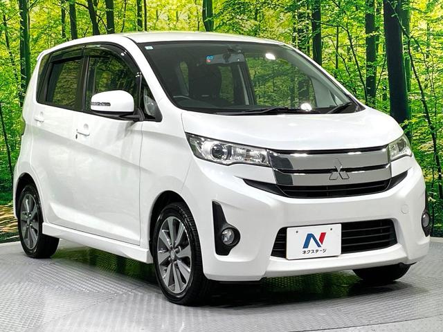 ｅＫカスタム Ｔ　ターボ　ｃｌａｒｉｏｎナビ　バックカメラ　禁煙車　ＥＴＣ　スマートキー　ＨＩＤヘッドライト　オートライト　オートエアコン　純正１４インチＡＷ　ＣＤ／ＤＶＤ再生（35枚目）