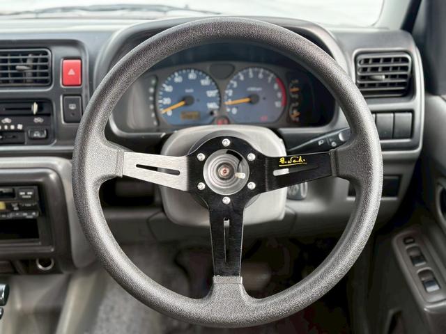 ジムニー ＸＧ　ＡＴ車／４ＷＤ／２－３インチリフトＵＰ／社外１６インチアルミ／車検令和８年１１月／パワステ／パワーウィンドウ／エアコン／保証書（12枚目）