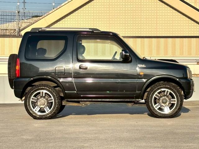 ジムニー ワイルドウインド　５速ＭＴ／パートタイム４ＷＤ／ルーフレール／背面タイヤ／シートヒーター／純正１６インチアルミ／ＣＤオーディオ／ミラーウィンカー／パワステ／パワーウィンドウ／エアコン／エアバック／革巻ステアリング（2枚目）