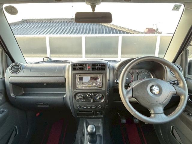 ジムニー ワイルドウインド　５速ＭＴ／パートタイム４ＷＤ／ルーフレール／背面タイヤ／シートヒーター／純正１６インチアルミ／ＣＤオーディオ／ミラーウィンカー／パワステ／パワーウィンドウ／エアコン／エアバック／革巻ステアリング（5枚目）